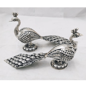 Pure silver peacock statues in fine carvings in an... by 